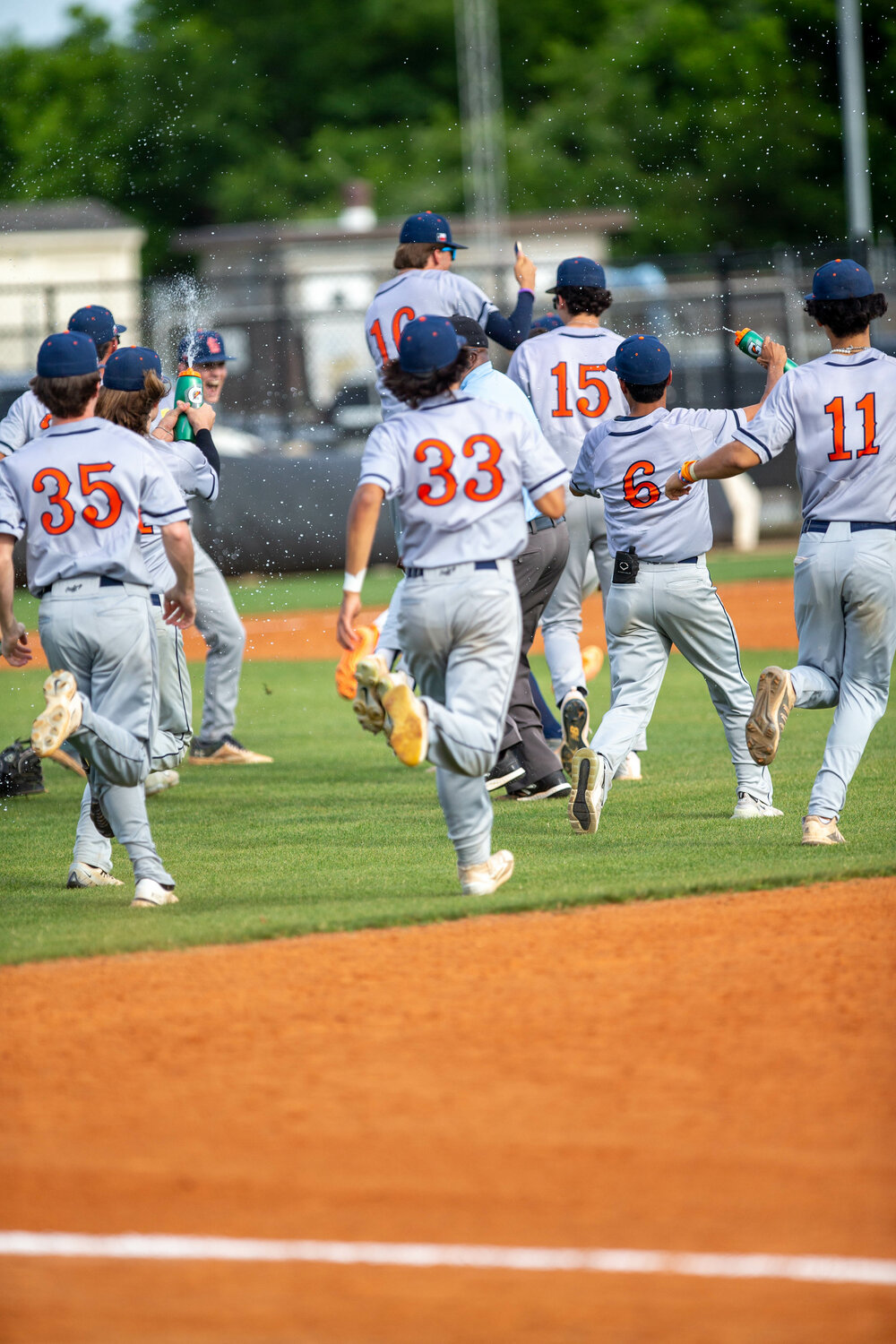 Seven Lakes players celebrate after winning a District 19-6A play in game between Seven Lakes and Taylor at the Mayde Creek baseball field.